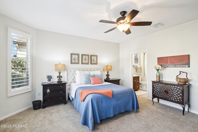 carpeted bedroom with ceiling fan and connected bathroom