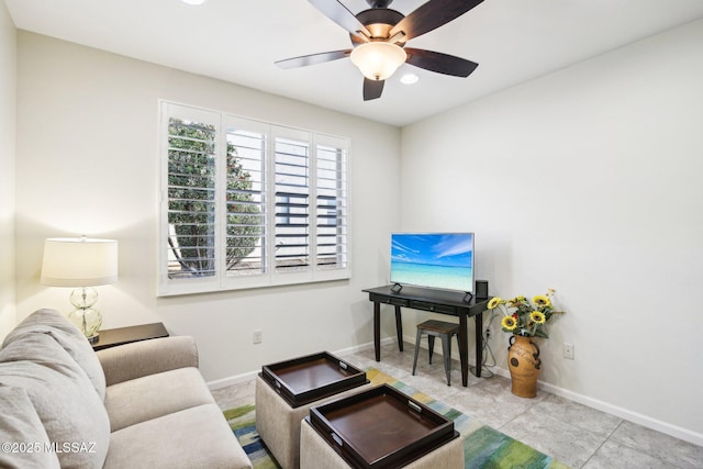 tiled living room with ceiling fan