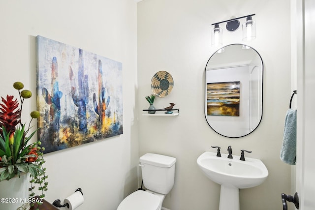 bathroom with sink and toilet