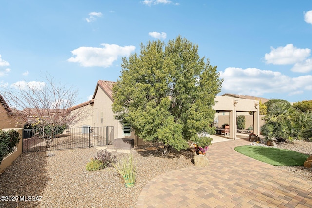 rear view of property featuring a patio area