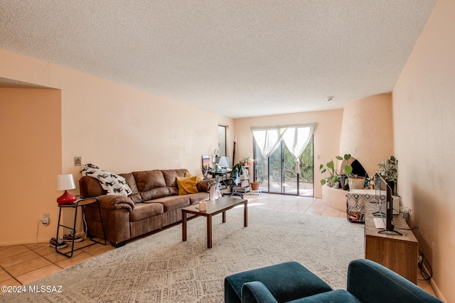 tiled living room with a textured ceiling