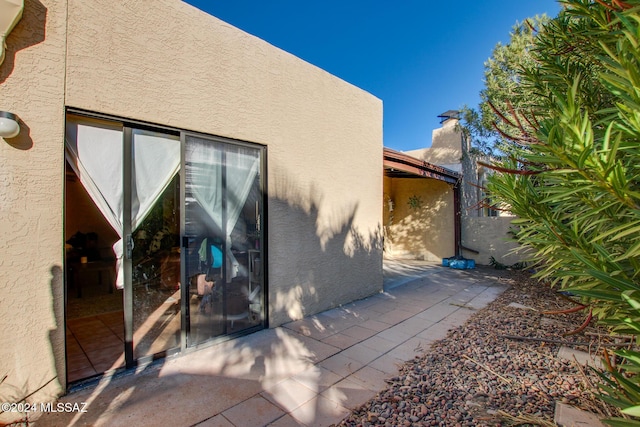 back of house with a patio