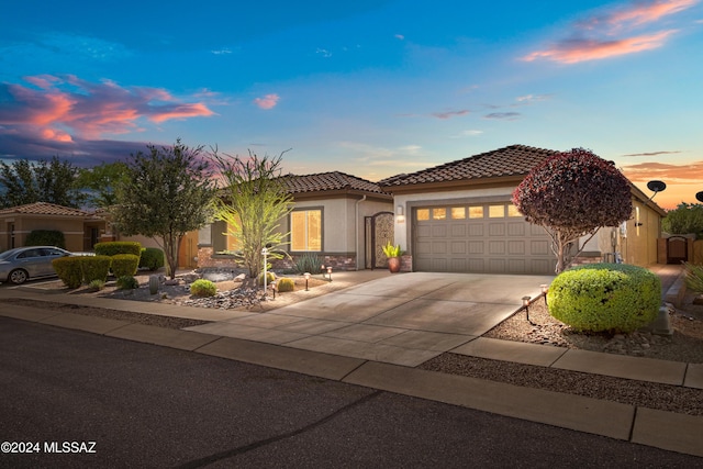 mediterranean / spanish-style house featuring a garage