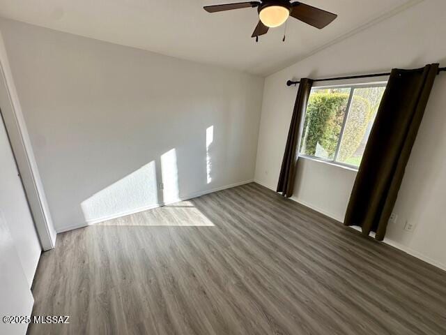 unfurnished room with ceiling fan, wood-type flooring, and lofted ceiling