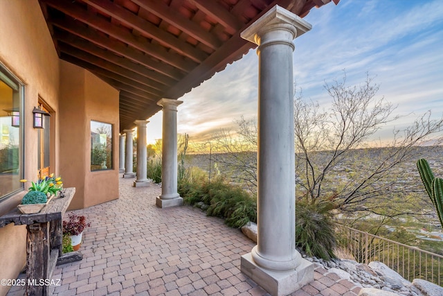 view of patio terrace at dusk