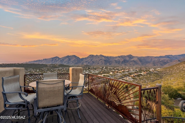 deck at dusk with a mountain view