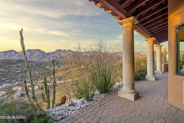 patio terrace at dusk with a mountain view