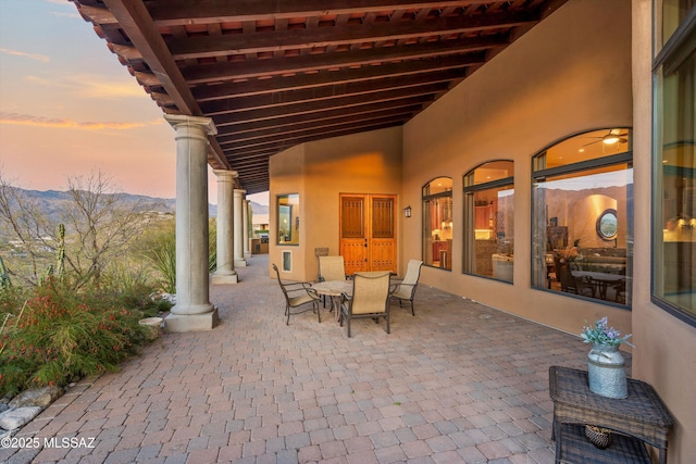 view of patio terrace at dusk