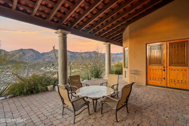 patio terrace at dusk with a mountain view