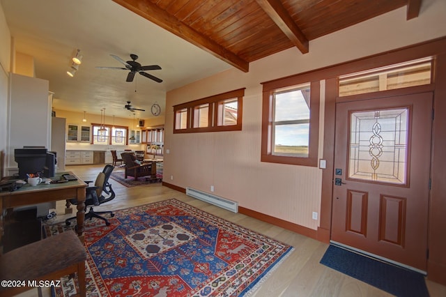 home office with wood ceiling, baseboard heating, ceiling fan, light hardwood / wood-style flooring, and beamed ceiling