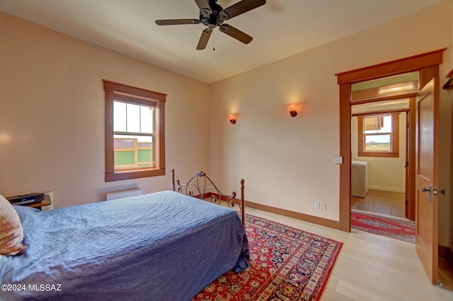 bedroom featuring light wood-type flooring and ceiling fan