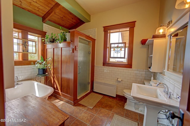 bathroom with radiator, shower with separate bathtub, toilet, wood ceiling, and tile walls