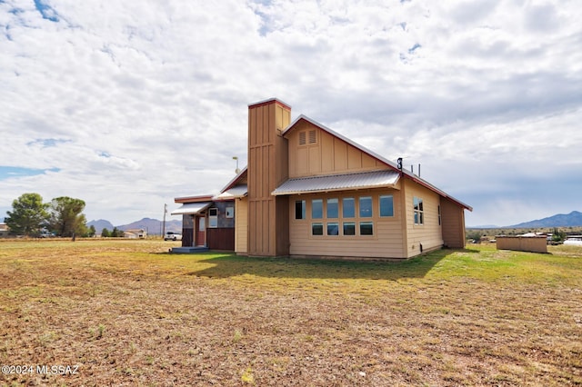 back of house featuring a mountain view