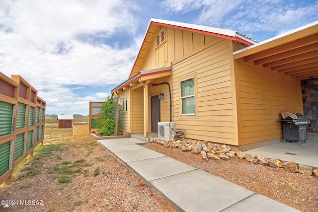 exterior space with ac unit