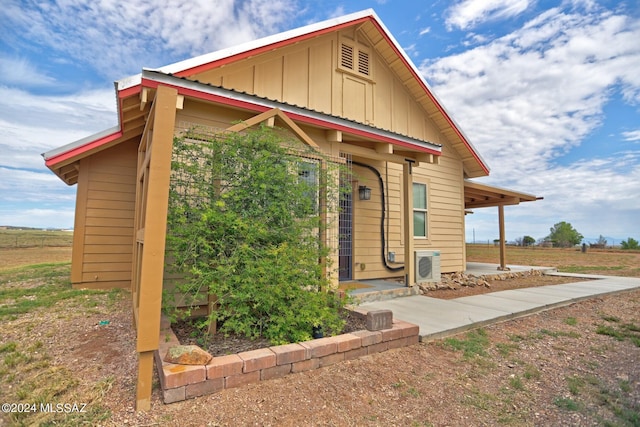 view of front of home with ac unit