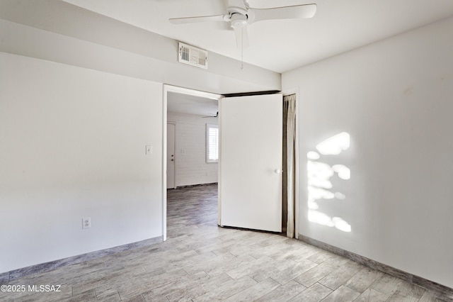 unfurnished room featuring ceiling fan and light wood-type flooring