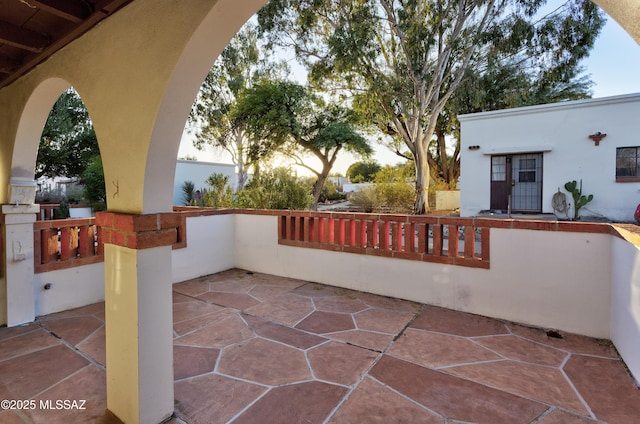 view of patio terrace at dusk