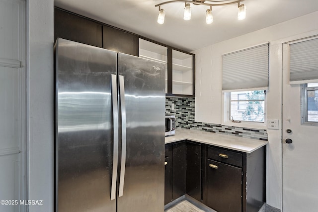 kitchen featuring backsplash and stainless steel appliances