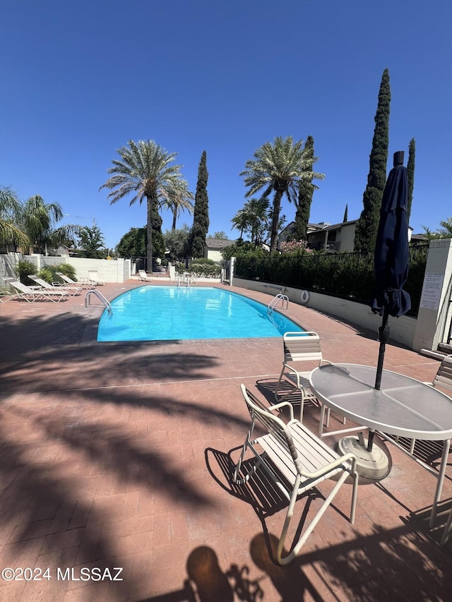 view of pool featuring a patio