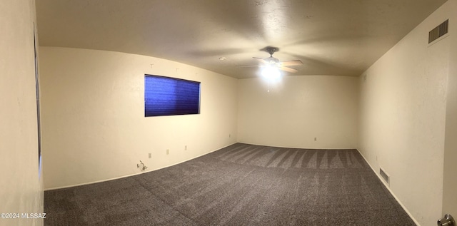 empty room with ceiling fan and carpet