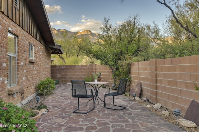 view of patio / terrace featuring a mountain view