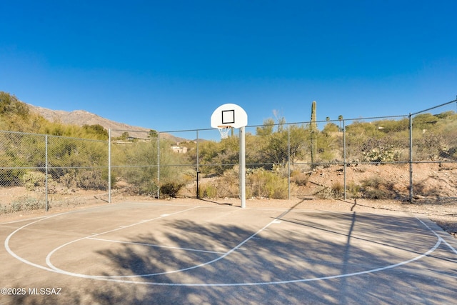 view of basketball court featuring a mountain view