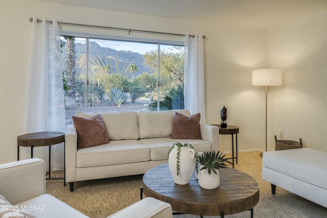 living room with light colored carpet and a mountain view