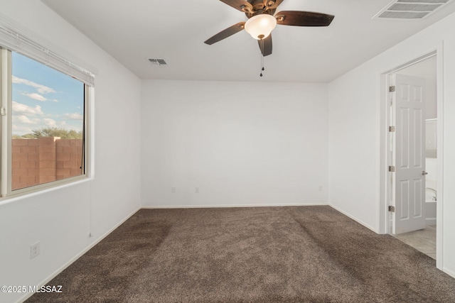 empty room with carpet flooring and ceiling fan