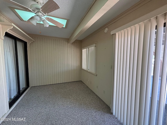 interior space with ceiling fan