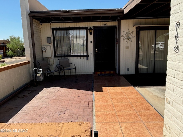 entrance to property featuring a patio area