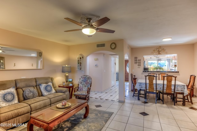 living room with ceiling fan and light tile patterned flooring