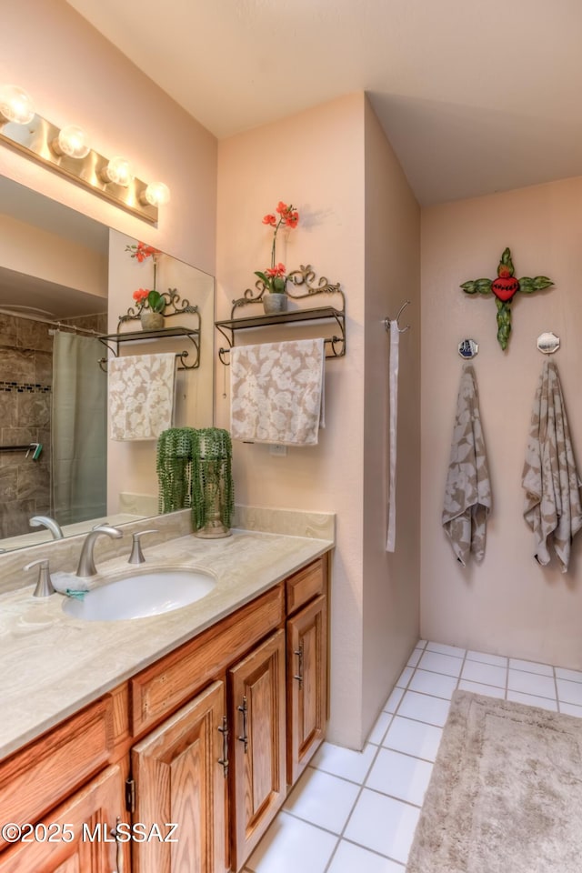 bathroom with tile patterned floors and vanity