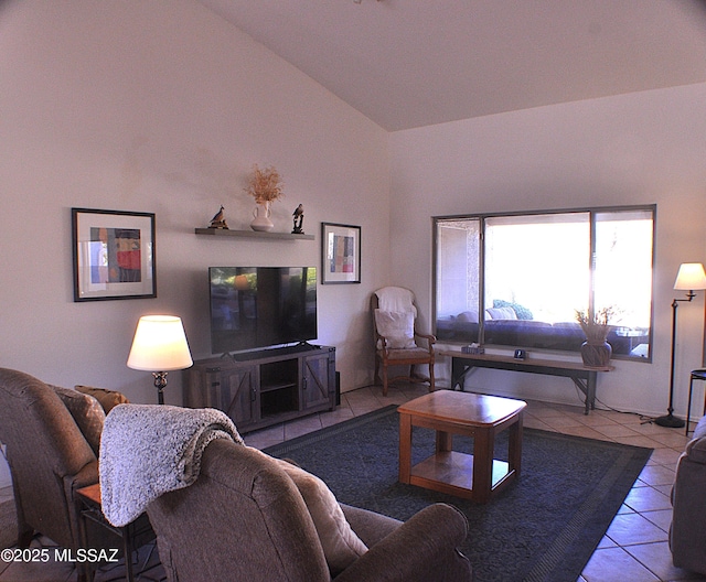 living room with tile patterned floors and lofted ceiling