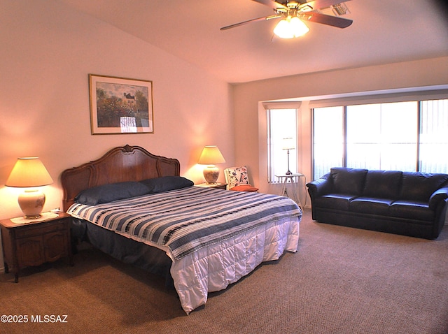 bedroom featuring ceiling fan, carpet floors, and lofted ceiling