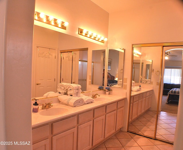 bathroom featuring vanity, tile patterned floors, and ceiling fan