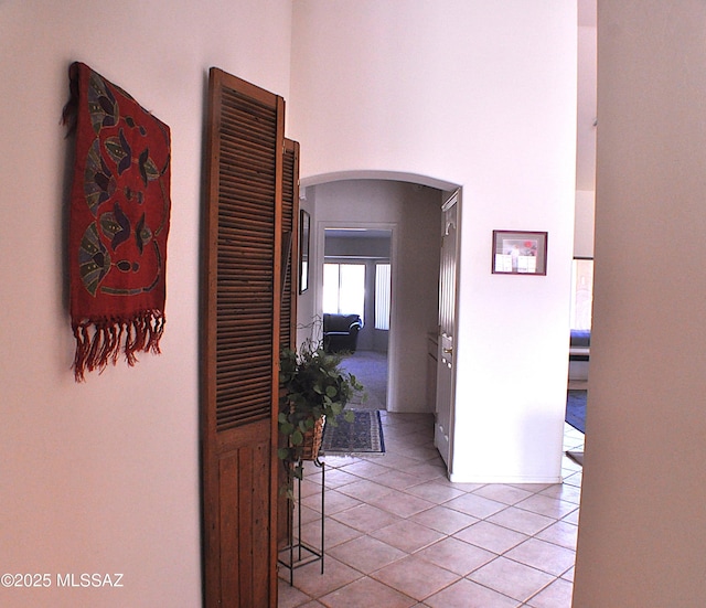 hallway featuring light tile patterned floors