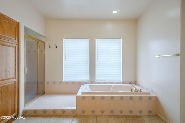 bathroom featuring tile patterned floors and plus walk in shower