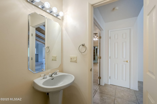 bathroom with tile patterned flooring and sink