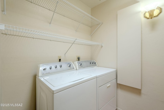 laundry room with washing machine and clothes dryer