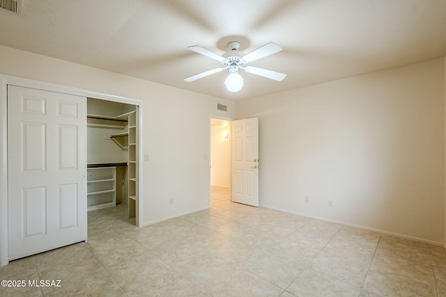 unfurnished bedroom with a closet and ceiling fan