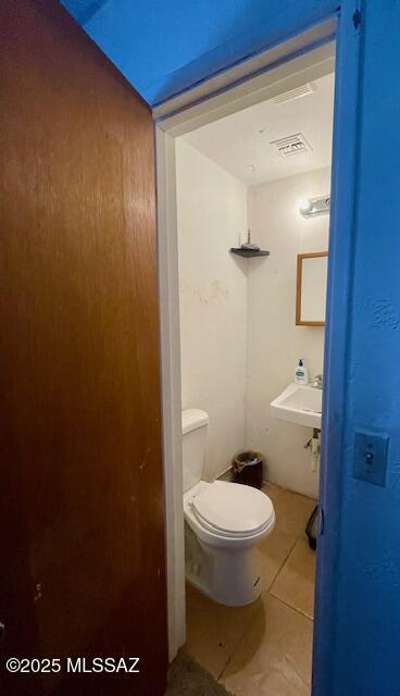 bathroom featuring tile patterned floors, sink, and toilet