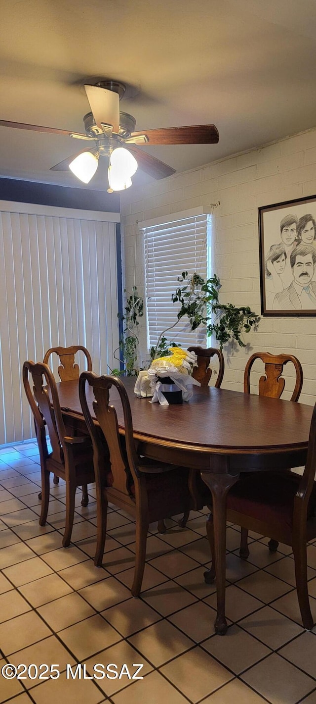 tiled dining room with ceiling fan