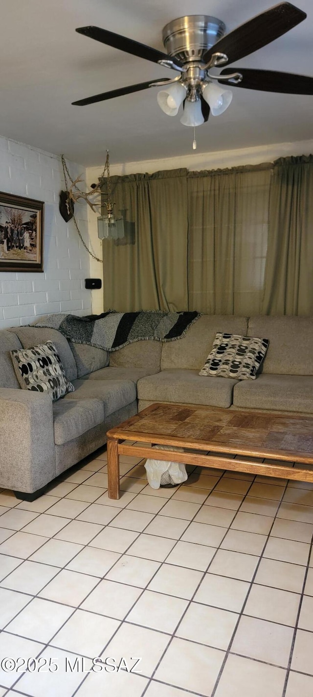 tiled living room with ceiling fan