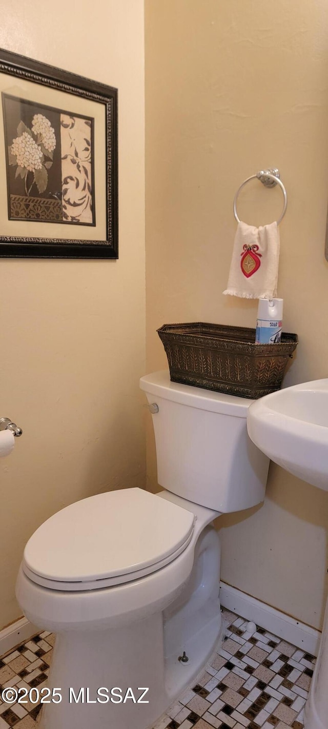 bathroom featuring tile patterned floors and toilet