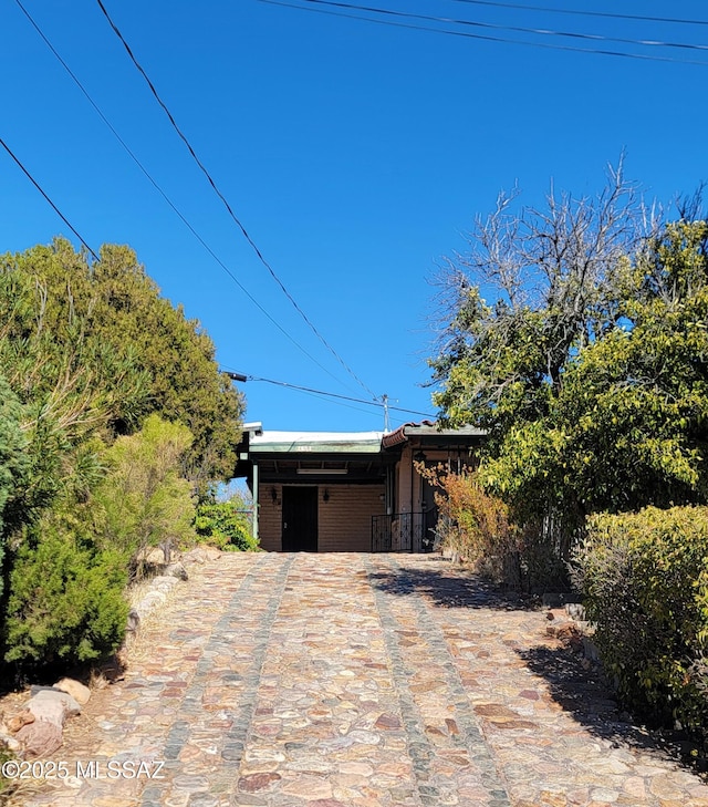 view of front of property featuring a carport