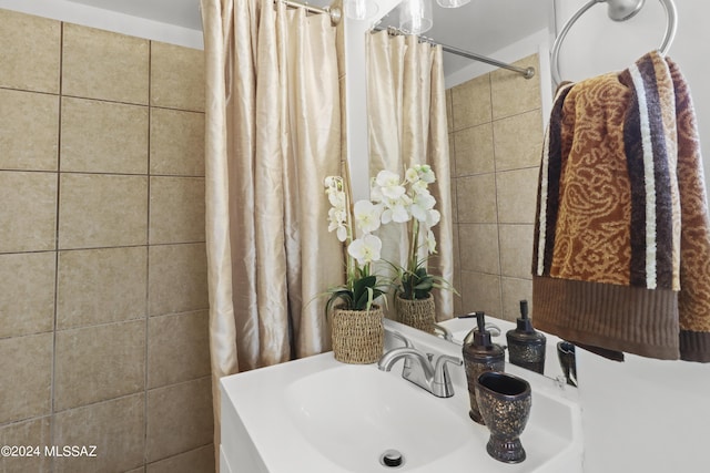 bathroom featuring sink and walk in shower