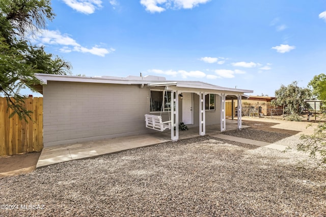 ranch-style home featuring a patio area