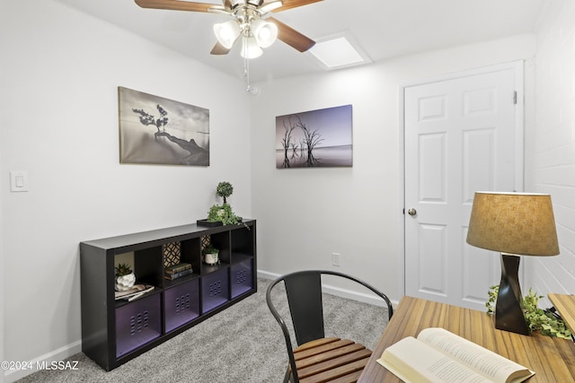 carpeted office space with ceiling fan