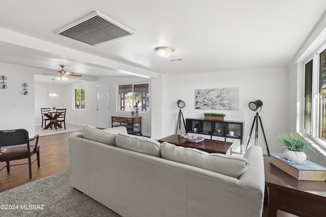 living room featuring ceiling fan and wood-type flooring