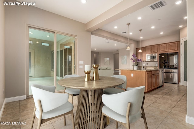 dining room featuring light tile patterned floors, baseboards, recessed lighting, and visible vents